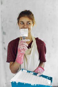 Portrait of woman drinking glass