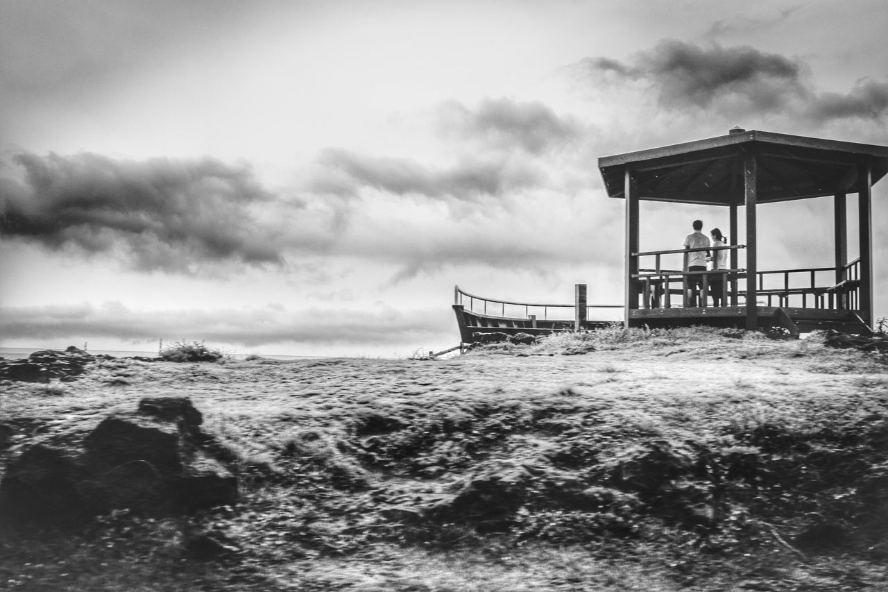 sea, water, sky, cloud - sky, built structure, horizon over water, architecture, cloudy, building exterior, cloud, scenics, nature, beach, tranquil scene, pier, tranquility, waterfront, beauty in nature, day, overcast