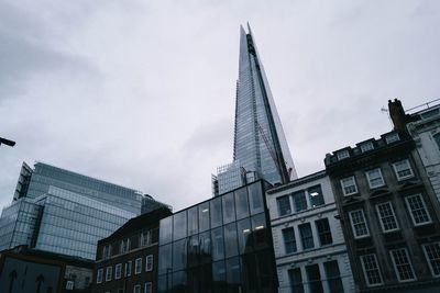 Low angle view of modern buildings against sky in city