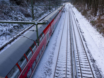 High angle view of train on snow covered railroad tracks