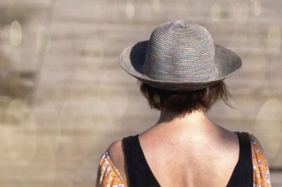 Rear view of woman wearing hat
