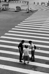 High angle view of people crossing road