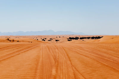 Scenic view of desert against clear sky