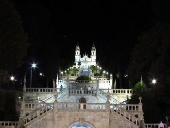 Illuminated buildings in city at night