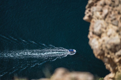 High angle view of rock in sea