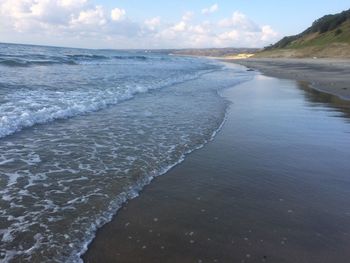 Scenic view of beach against sky