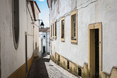 Narrow street amidst buildings in town