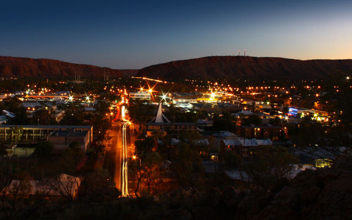 High angle view of illuminated cityscape at night