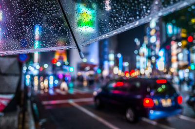 Illuminated city street at night