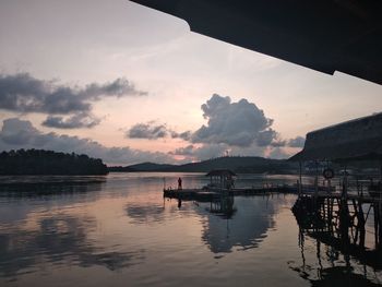 Scenic view of lake against sky during sunset