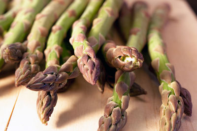 Many asparagus on a wooden plate healthy vegetable food