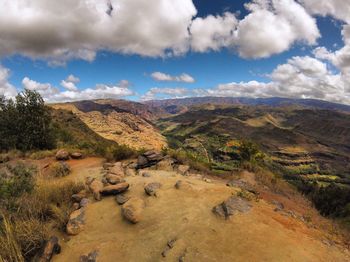 Scenic view of mountains against cloudy sky