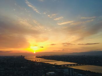 High angle view of buildings against sky during sunset