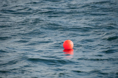 A bouy in the sea marking the location of fishing nets
