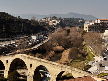 High angle view of train by road against sky