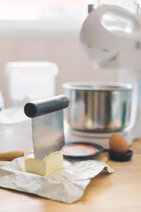 Close-up of baking ingredients and kitchen utensils on table