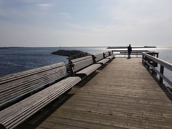 Pier over sea against sky