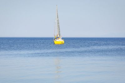 Sailboat sailing in sea