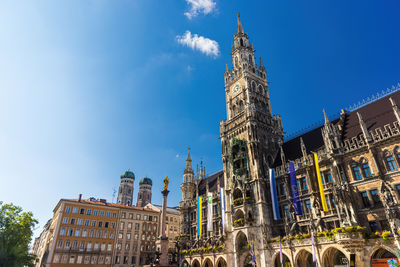 Buildings in city against sky