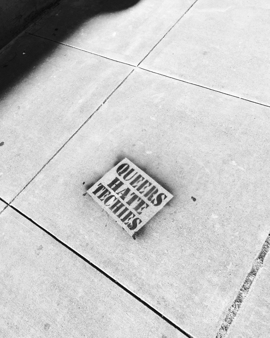 high angle view, tiled floor, footpath, elevated view, paving stone, damaged, day, outdoors, repetition, concrete, no people, geometric shape