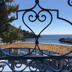 Close-up of railing against sea
