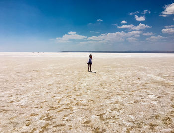 Man on beach against sky