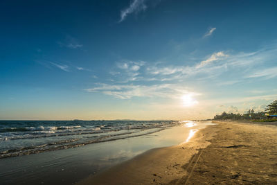 Scenic view of beach against sky during sunset