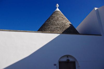 Low angle view of building against blue sky