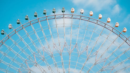 Low angle view of ferris wheel against sky