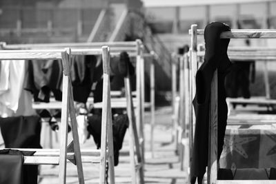 Clothes hanging on wooden racks
