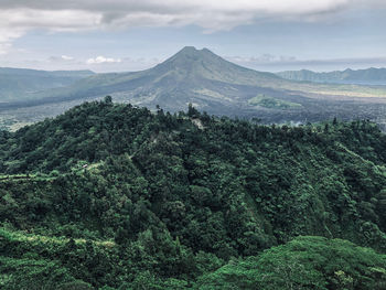 Scenic view of landscape and mountains against sky