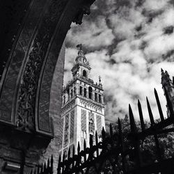 Low angle view of historical building against cloudy sky