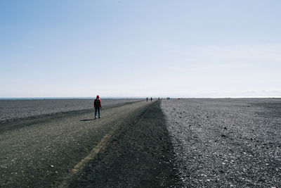 Man on field against clear sky