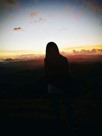 Silhouette woman at sunset