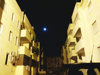 Buildings in city at night