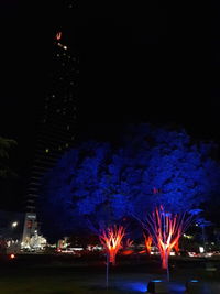 Firework display in city at night