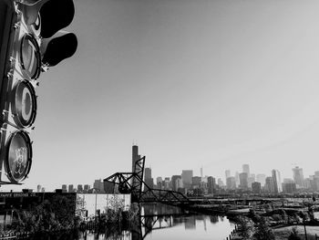 Buildings in city against clear sky