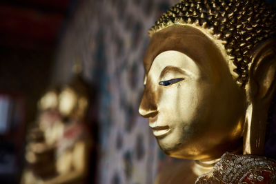 Close-up of statue against temple