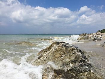 Scenic view of beach and sea against sky