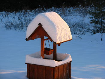 Snow covered wishing well