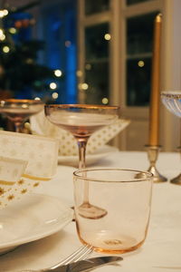 High angle view of napkin in plate with wineglasses on table