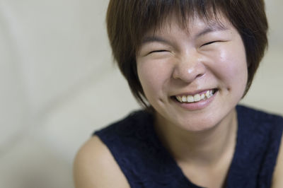 Close-up portrait of a smiling young woman