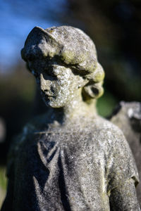 Close-up of statue in cemetery