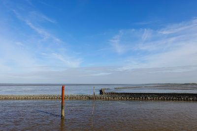 Scenic view of sea against blue sky