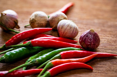 Close-up of chili peppers on table