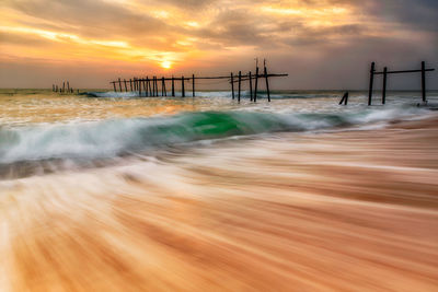 Close-up of sea against sky during sunset