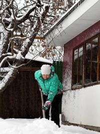 Full length of boy standing on snow