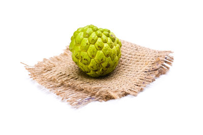 Close-up of fruit on white background