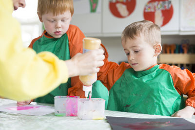 Two boys painting