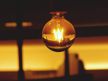 Close-up of illuminated light bulb